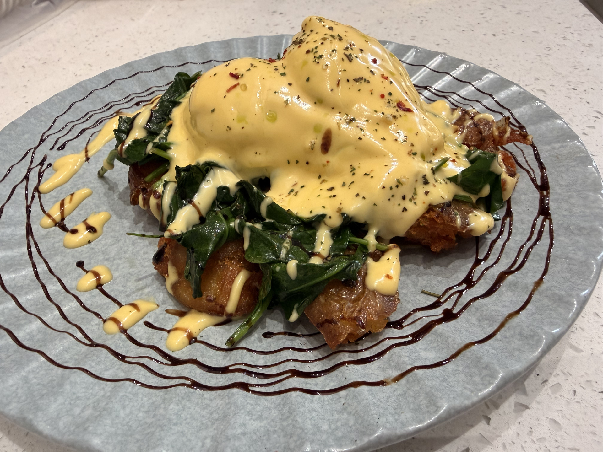 Smashed potato benedict with spinach and hollandaise